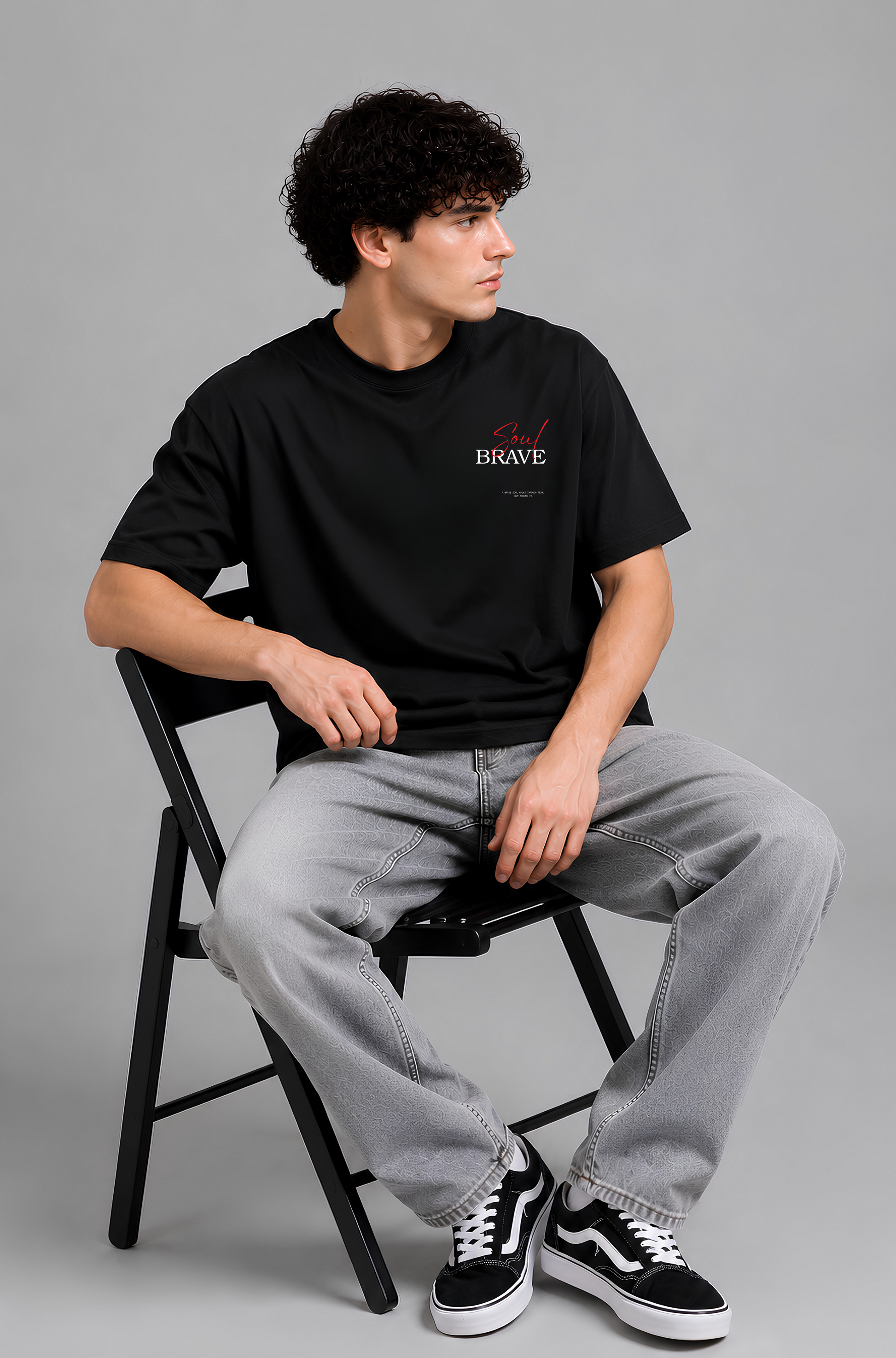 Black graphic print t-shirt men - seated pose