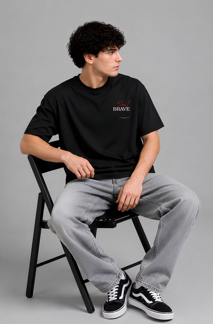 Black graphic print t-shirt men - seated pose